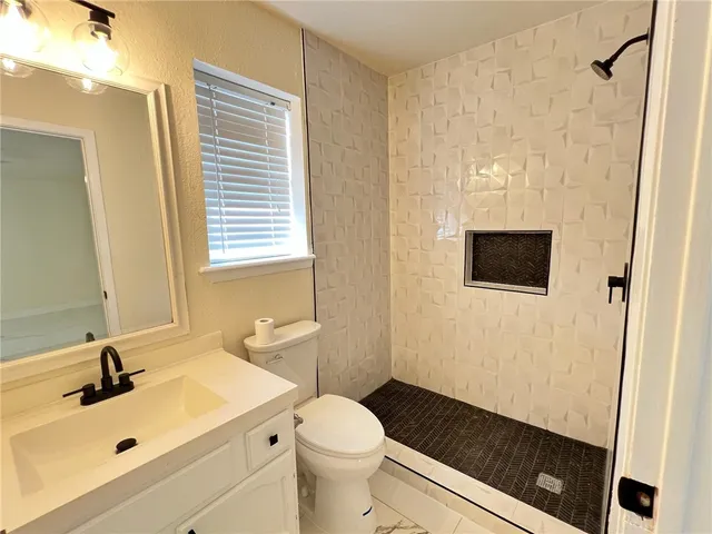 a bathroom with a toilet and a sink