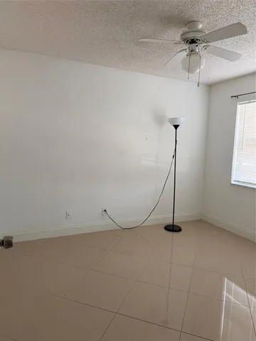 a swimming pool with a bench in front of it