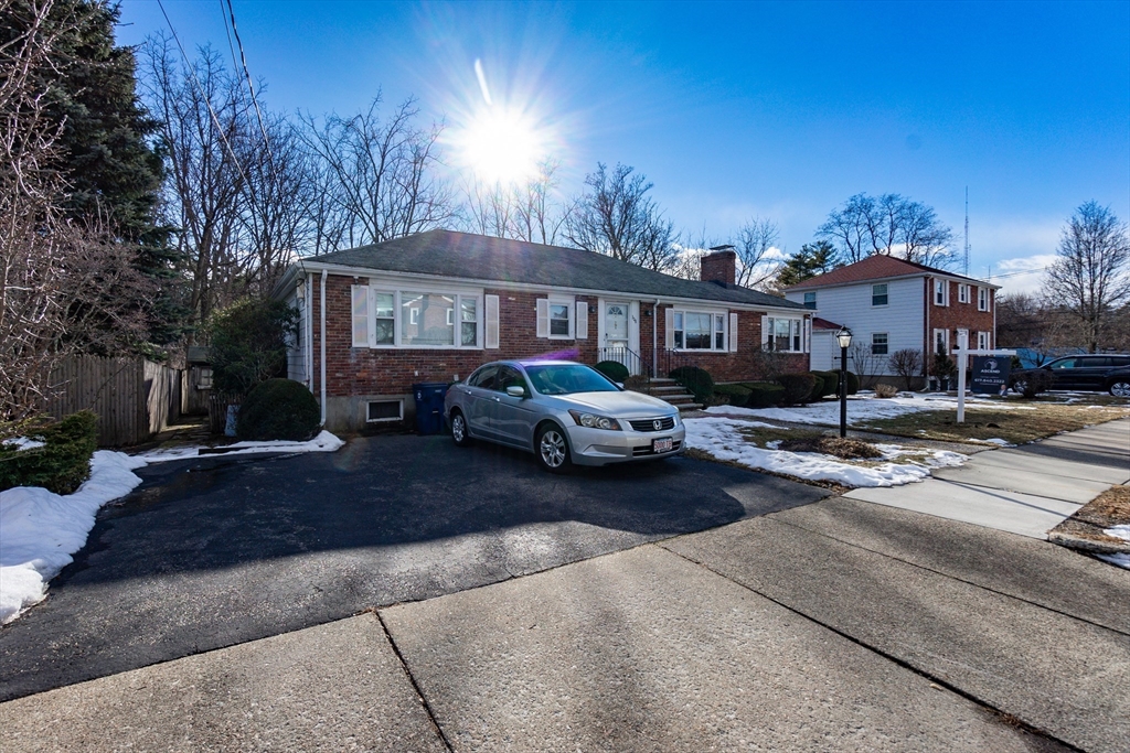 308 Woodcliff Road Newton, MA 02461 - Photo 3 of 4 a city street lined with buildings and cars