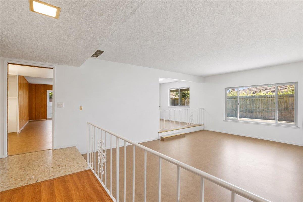69 Springbrook Circle Sacramento, CA 95831 - Photo 8 of 29 a view of an empty room with wooden floor and a window