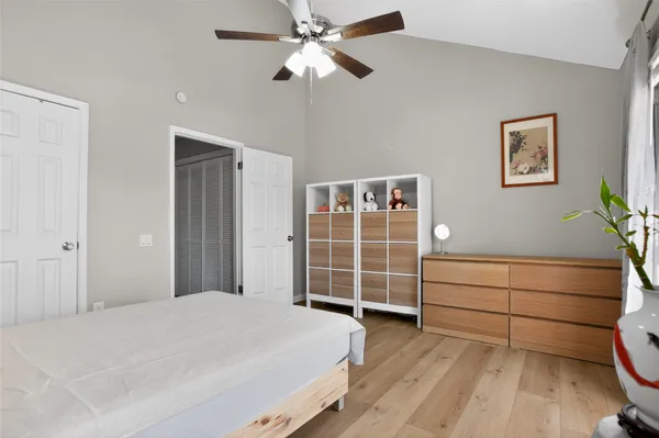 a bedroom with a bed and a closet
