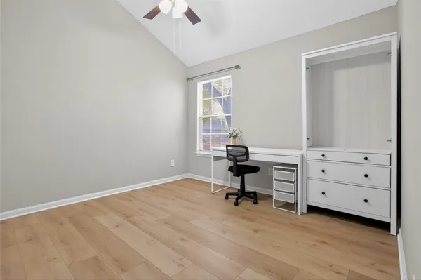 a view of a room with cabinet wooden floor and windows