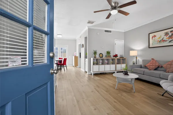 a living room with furniture and a large window