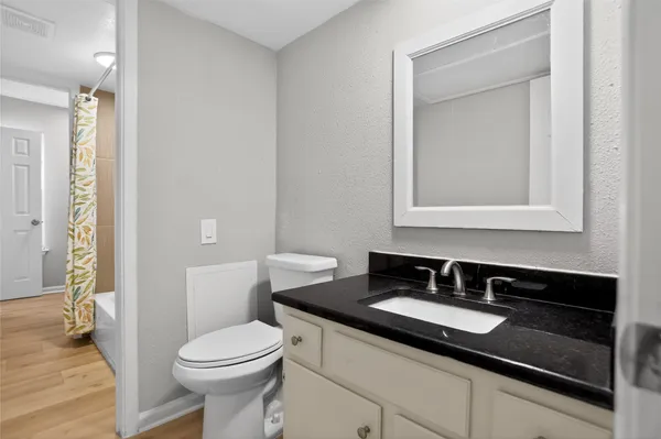 a bathroom with a sink and a toilet