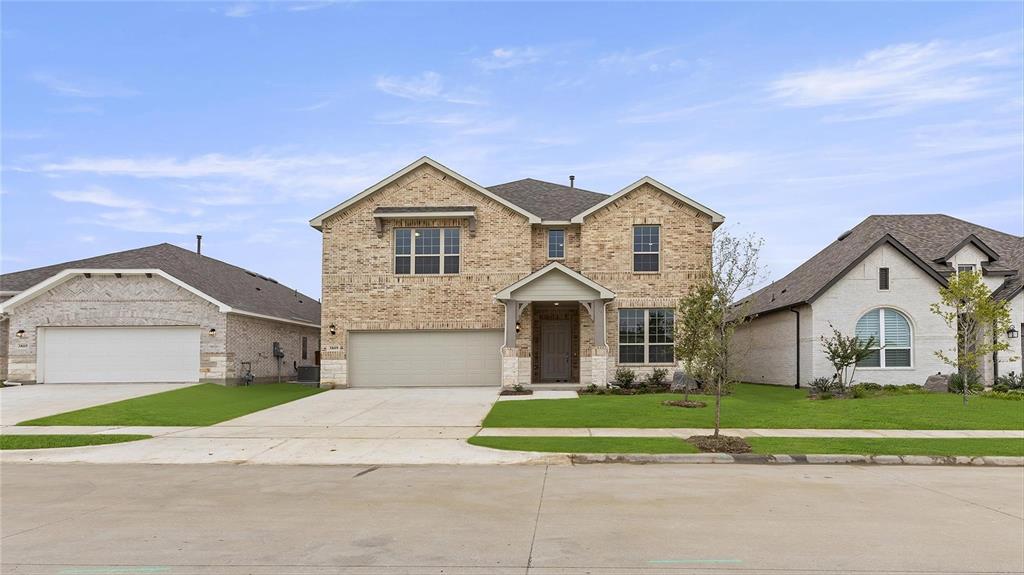 3809 Paradise Way Sherman, TX 75090 - Photo 1 of 16 a front view of a house with a yard and garage