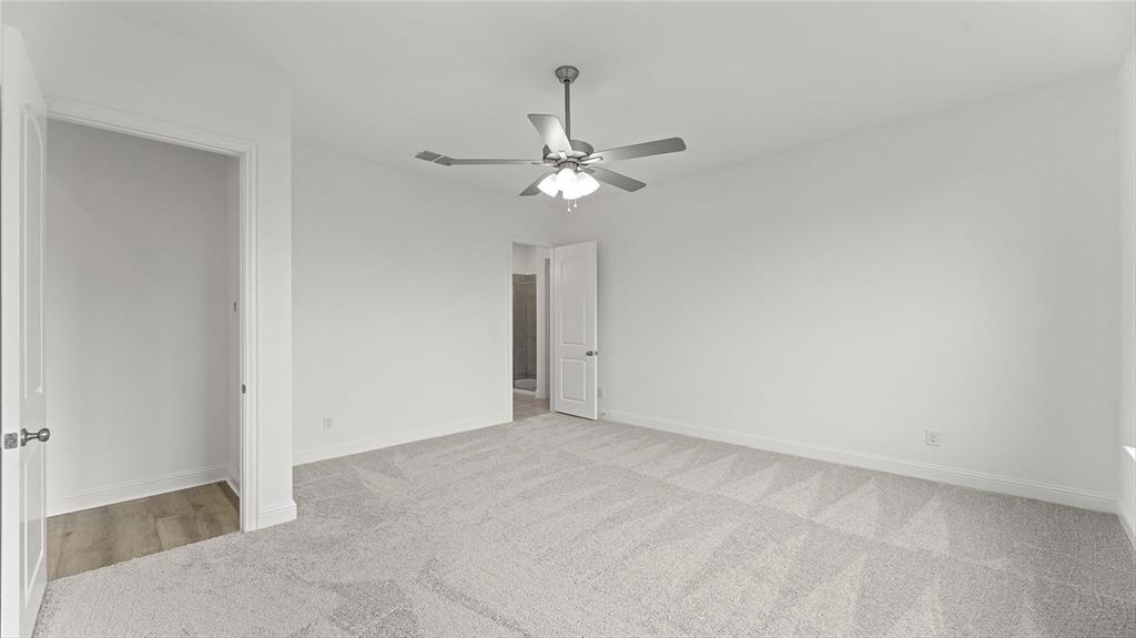 3809 Paradise Way Sherman, TX 75090 - Photo 14 of 16 a view of an empty room with a ceiling fan