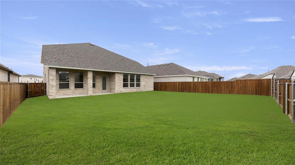 3809 Paradise Way Sherman, TX 75090 - Photo 15 of 16 a view of a house with a backyard