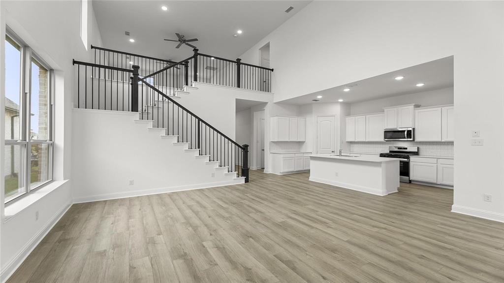 3809 Paradise Way Sherman, TX 75090 - Photo 3 of 16 a view of kitchen with wooden floor and electronic appliances
