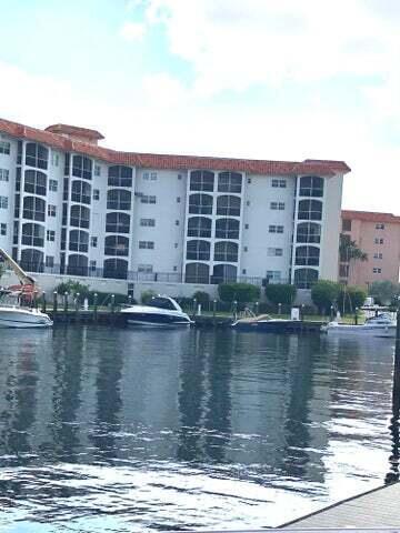 2871 North Ocean Boulevard, Unit M226 Boca Raton, FL 33431 - Photo 12 of 45 a view of a lake with a building