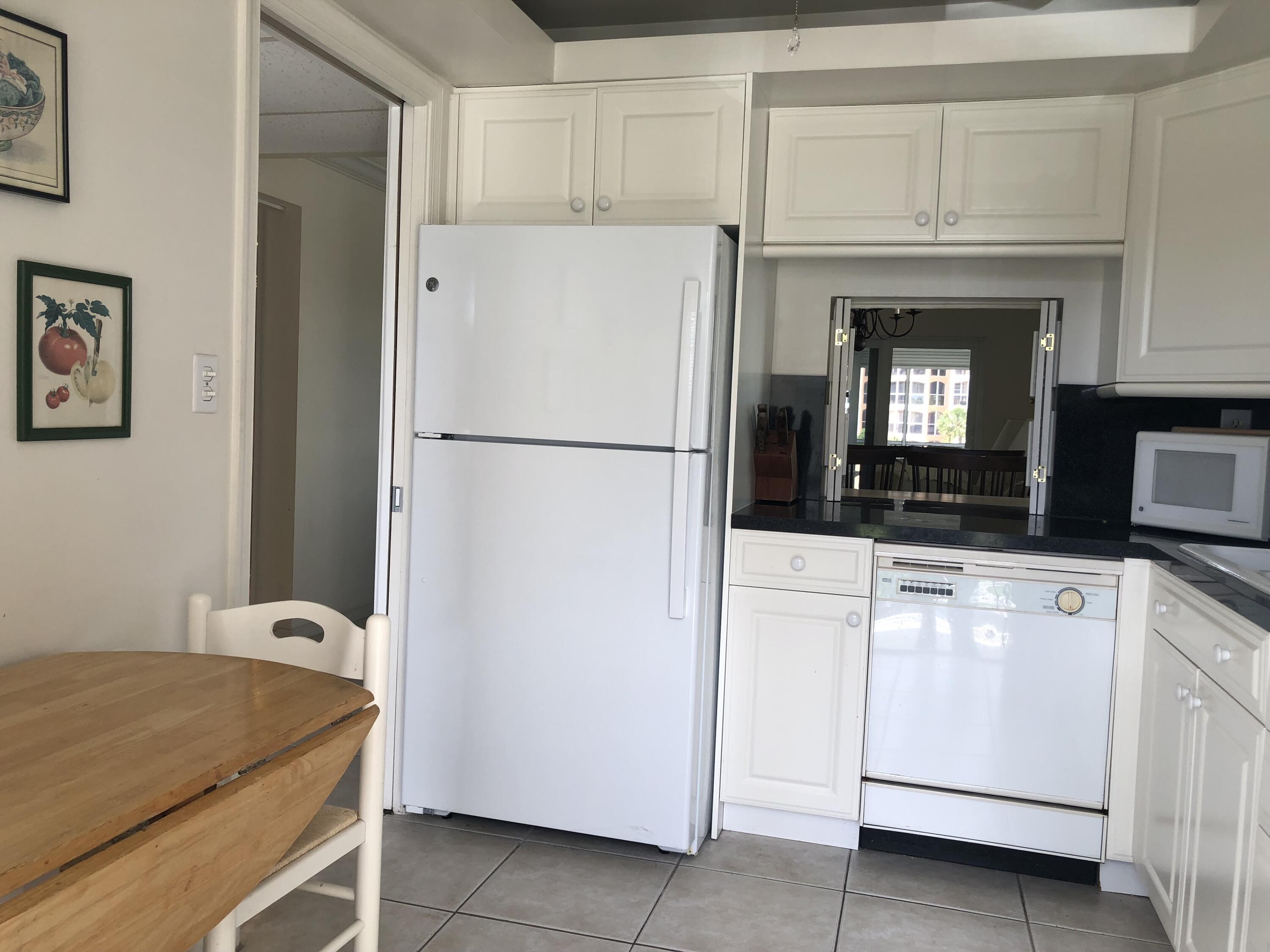 2871 North Ocean Boulevard, Unit M226 Boca Raton, FL 33431 - Photo 17 of 45 a utility room with dryer and washer