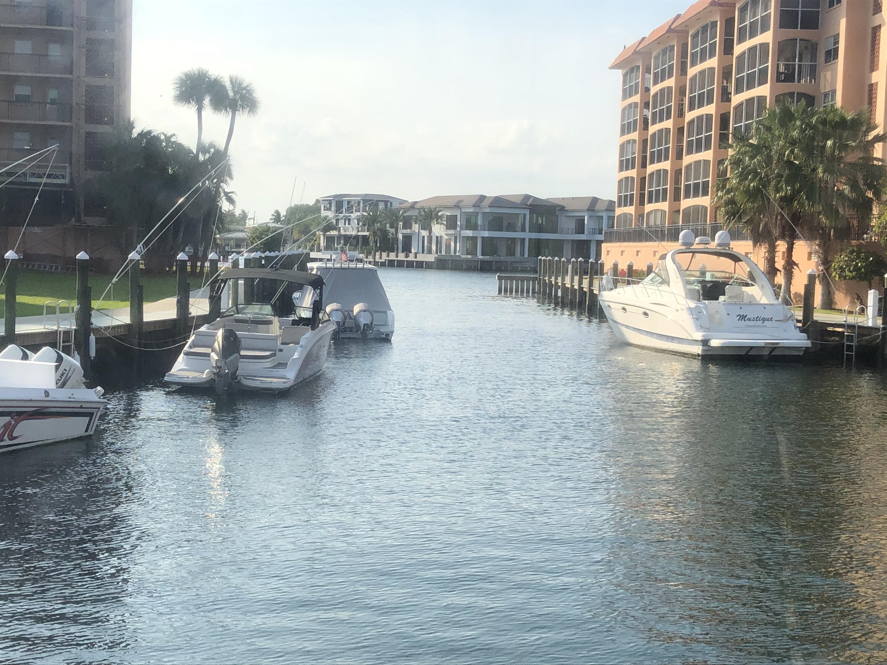 2871 North Ocean Boulevard, Unit M226 Boca Raton, FL 33431 - Photo 21 of 45 a view of a lake with tall buildings