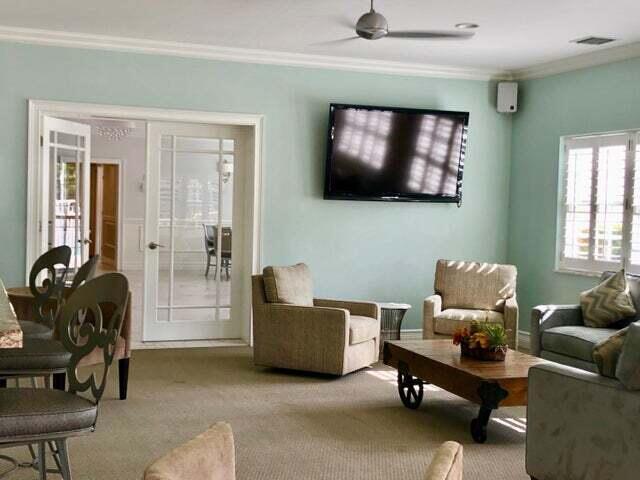 2871 North Ocean Boulevard, Unit M226 Boca Raton, FL 33431 - Photo 28 of 45 a living room with furniture and a flat screen tv