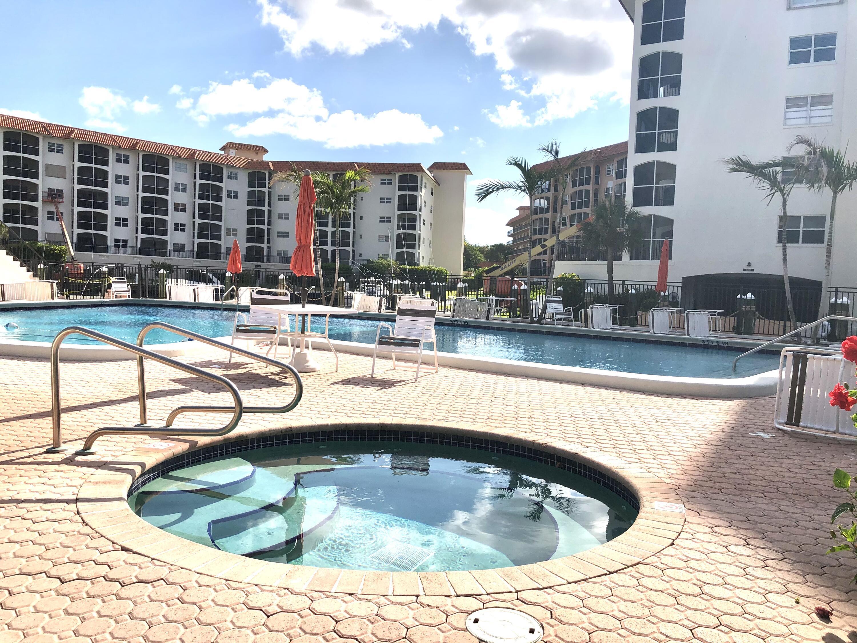 2871 North Ocean Boulevard, Unit M226 Boca Raton, FL 33431 - Photo 30 of 45 a view of swimming pool with outdoor seating