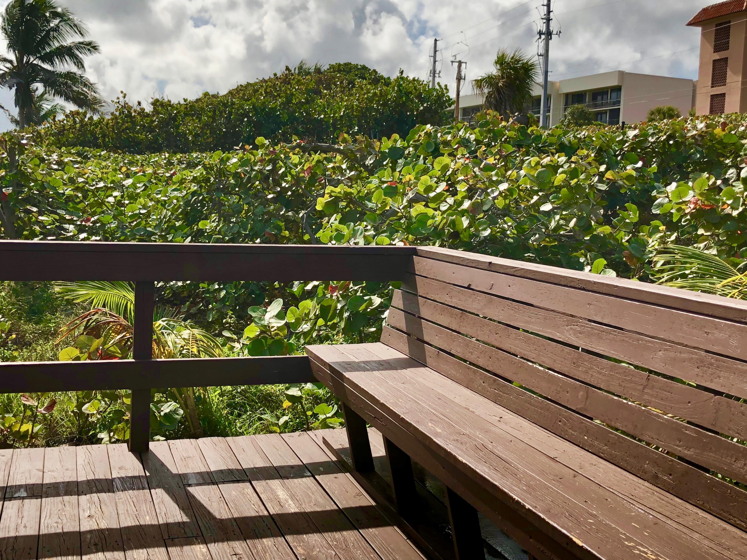 2871 North Ocean Boulevard, Unit M226 Boca Raton, FL 33431 - Photo 7 of 45 a view of a bench in the balcony