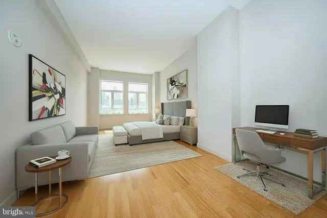 a bedroom with a bed and a couch