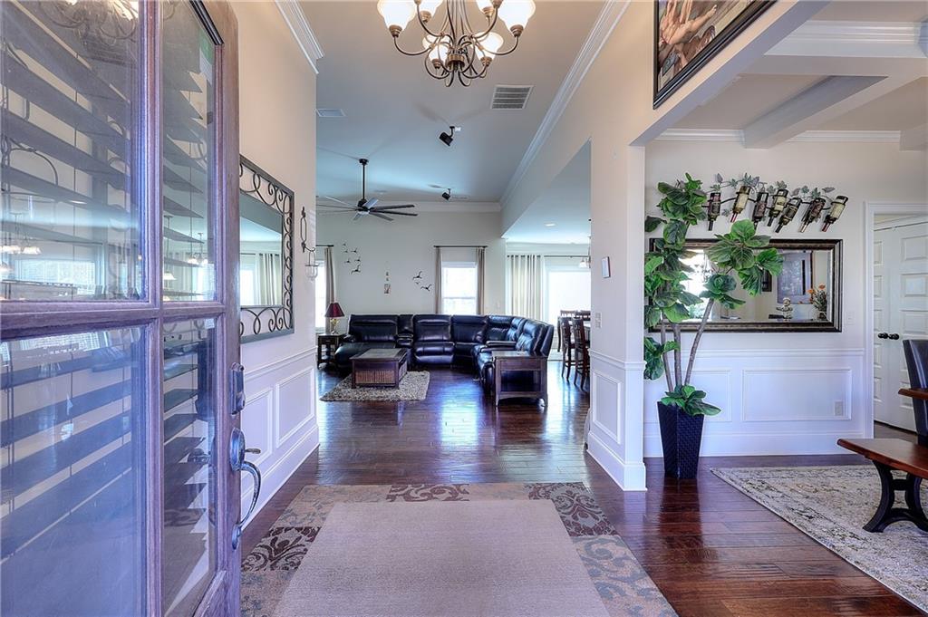 1079 Monticello Drive Monroe, GA 30655 - Photo 13 of 57 a living room with fireplace furniture and a chandelier