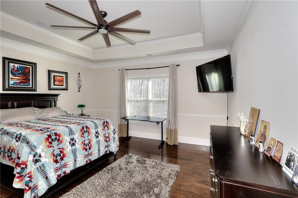 1079 Monticello Drive Monroe, GA 30655 - Photo 21 of 57 a bedroom with a bed and a flat screen tv