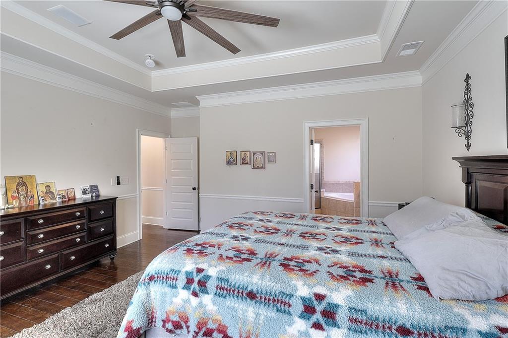 1079 Monticello Drive Monroe, GA 30655 - Photo 22 of 57 a bedroom with a bed and a dresser