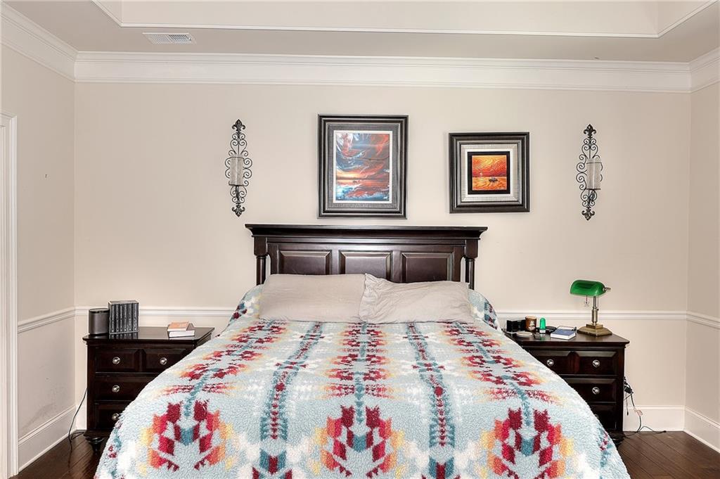 1079 Monticello Drive Monroe, GA 30655 - Photo 23 of 57 a bedroom with a bed and a lamp on dresser