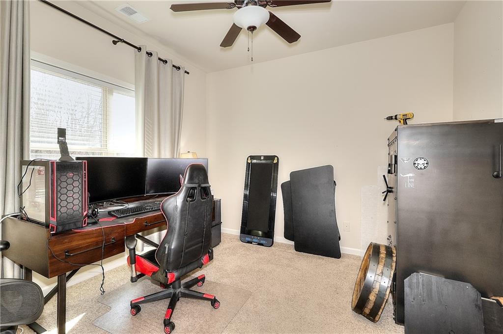 1079 Monticello Drive Monroe, GA 30655 - Photo 27 of 57 a view of a workspace with furniture and a window