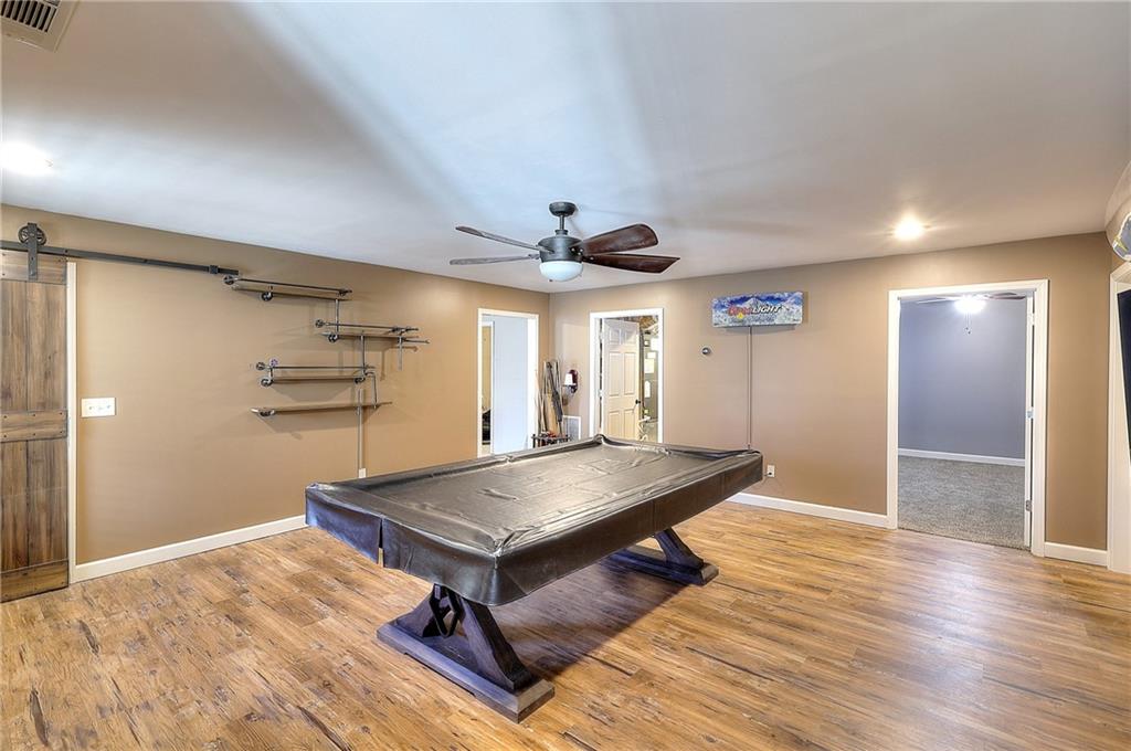 1079 Monticello Drive Monroe, GA 30655 - Photo 39 of 57 a room with wooden floor and pool table
