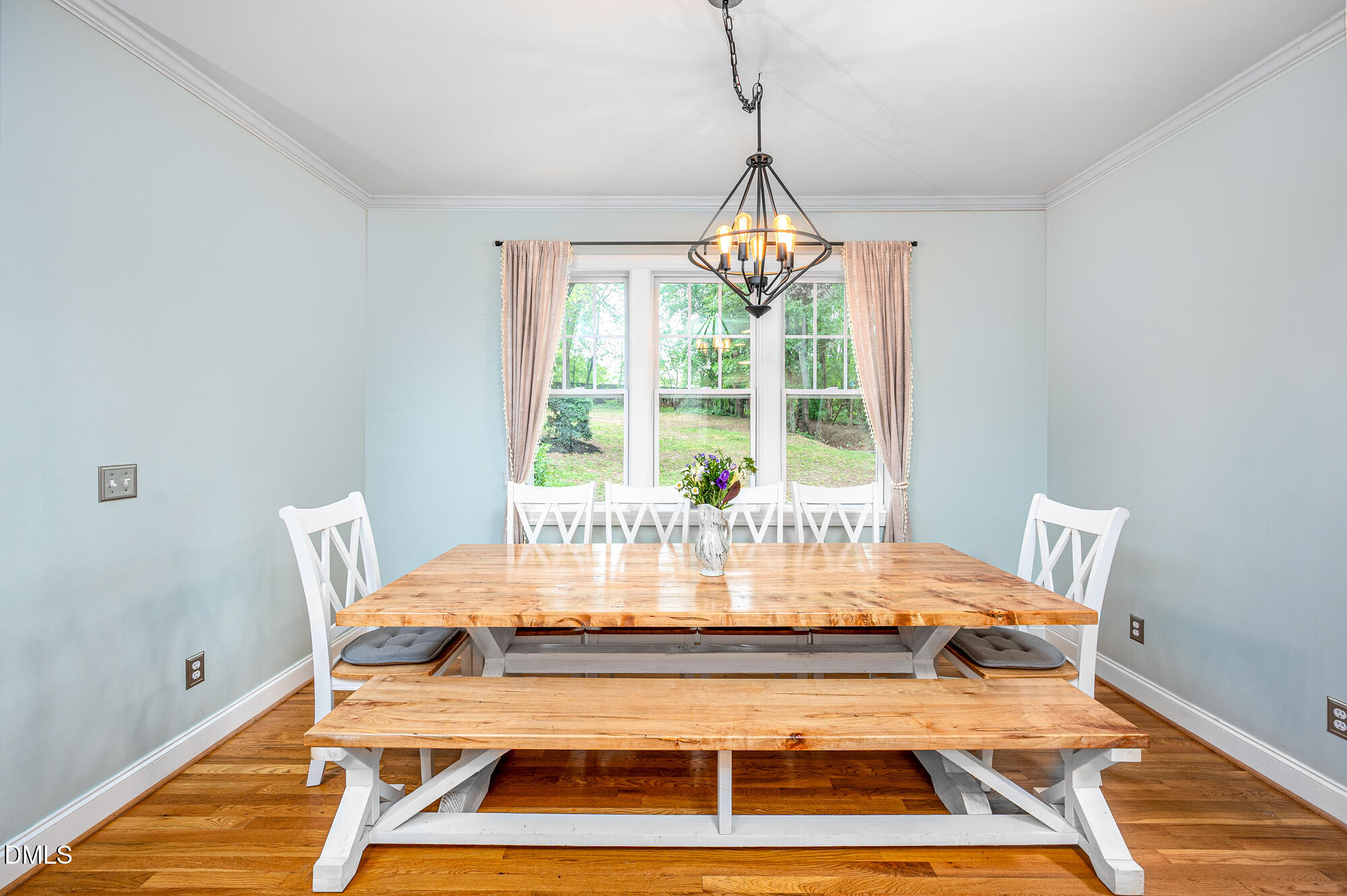 726 Ruth Circle Fuquay-Varina, NC 27526 - Photo 20 of 61 a view of a dining room with furniture wooden floor and chandelier