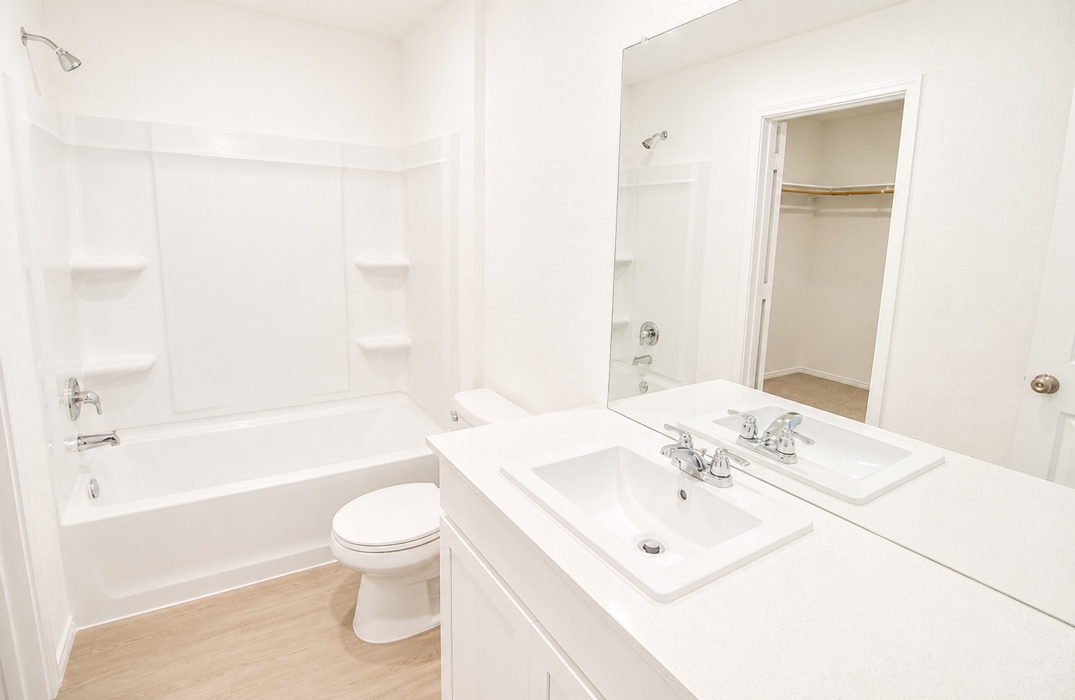 397 Keefer Kyle, TX 78640 - Photo 18 of 33 Refined bathroom with sleek single vanity, tub, and shower for daily rejuvenation.