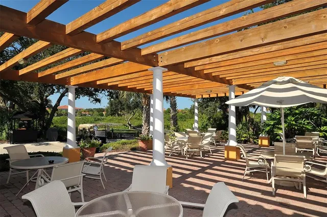 a very nice looking living room with furniture and a large window