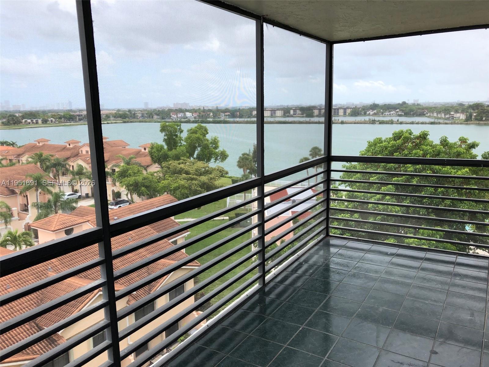 20840 San Simeon Way, Unit 702 Miami, FL 33179 - Photo 12 of 34 a view of a balcony with lake view and the ocean view