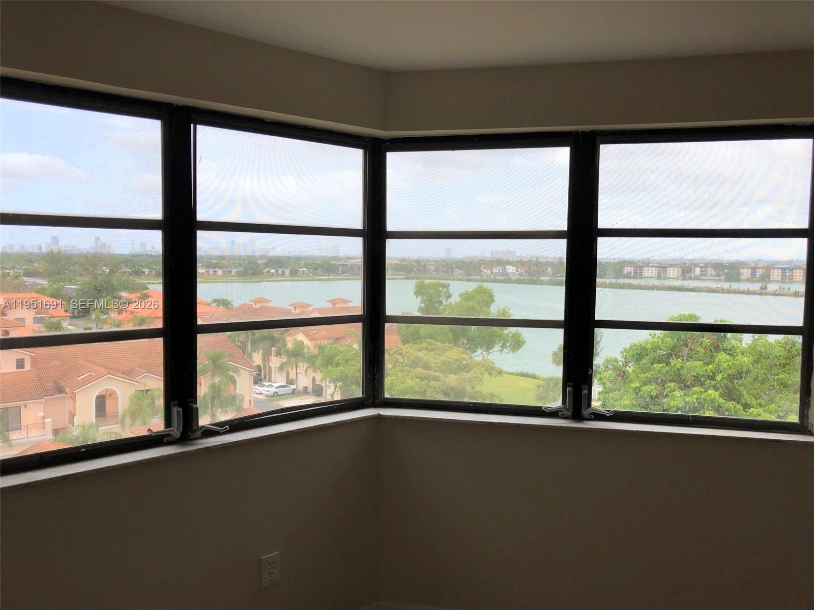 20840 San Simeon Way, Unit 702 Miami, FL 33179 - Photo 13 of 34 a view of a large window with an outdoor space