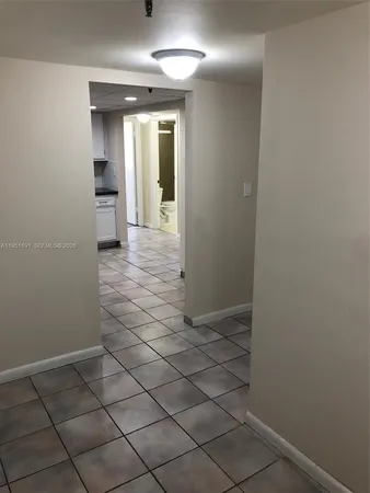 a view of a room that has a window in it