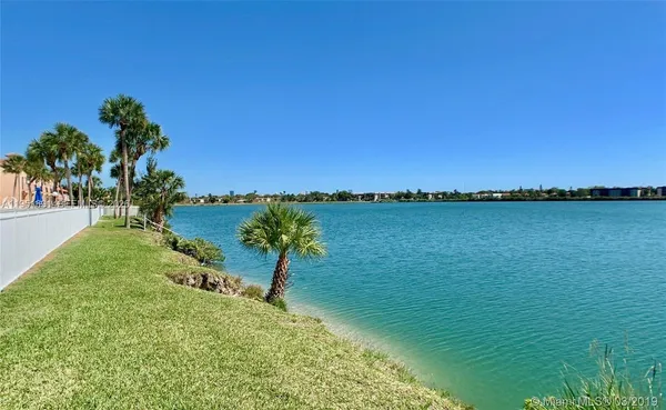 a view of a lake with a garden