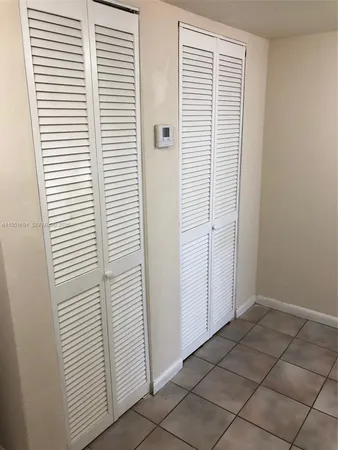 a kitchen with stainless steel appliances granite countertop a stove a refrigerator and a sink