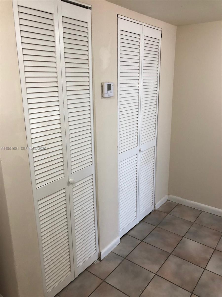 20840 San Simeon Way, Unit 702 Miami, FL 33179 - Photo 3 of 34 a view of a room that has a window in it