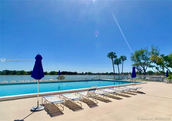 a view of swimming pool with a lake view