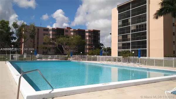 a view of a swimming pool and an outdoor seating