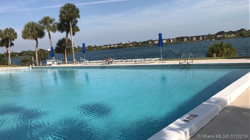 20840 San Simeon Way, Unit 702 Miami, FL 33179 - Photo 34 of 34 a view of a swimming pool and an outdoor seating