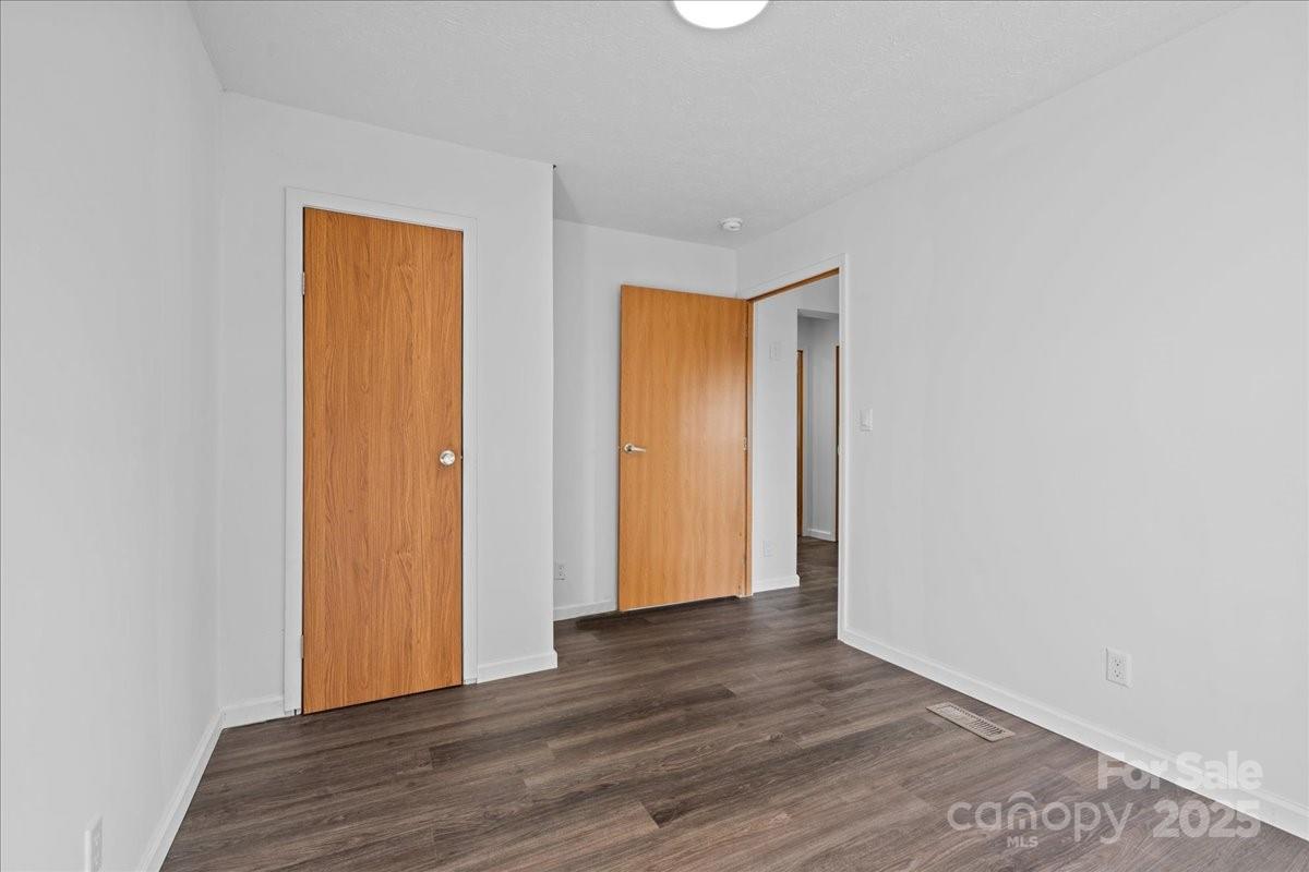 282 Bob Hardin Road Rutherfordton, NC 28139 - Photo 18 of 27 a view of an empty room with wooden floor and closet