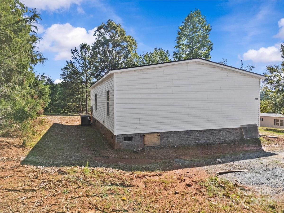 282 Bob Hardin Road Rutherfordton, NC 28139 - Photo 22 of 27 a view of a house with a yard