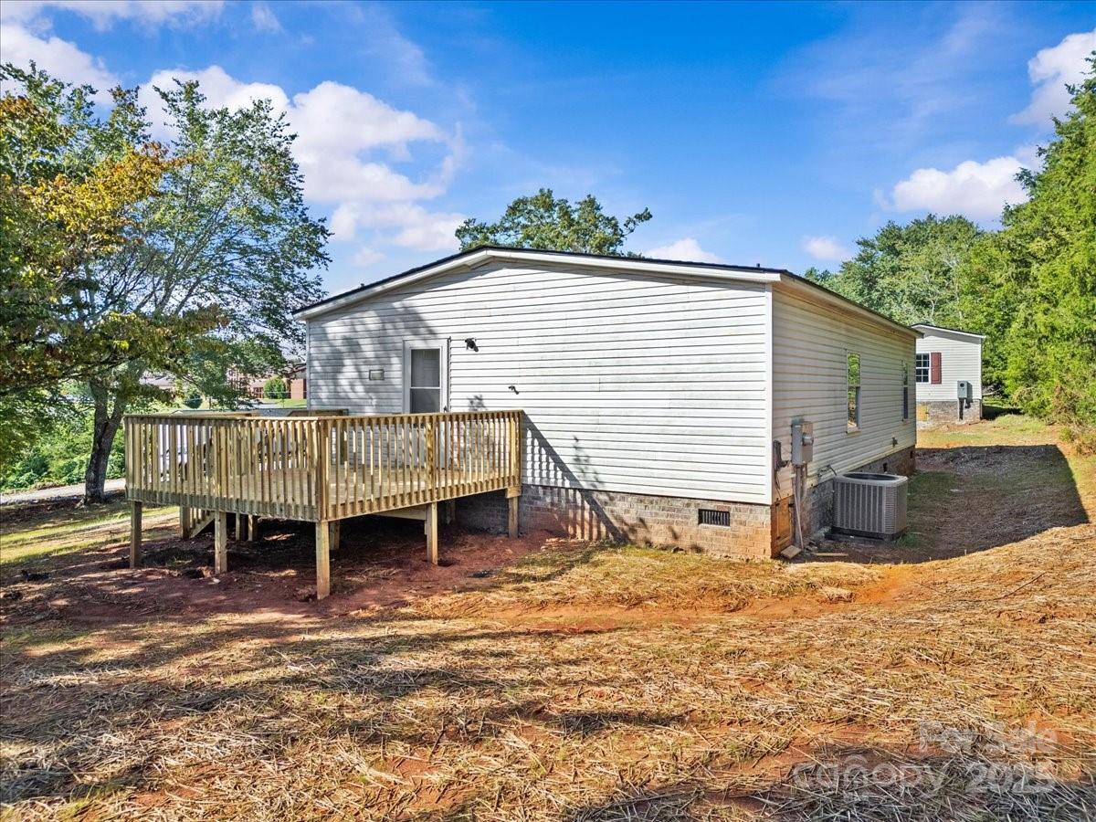282 Bob Hardin Road Rutherfordton, NC 28139 - Photo 23 of 27 a view of a house with a patio and a yard