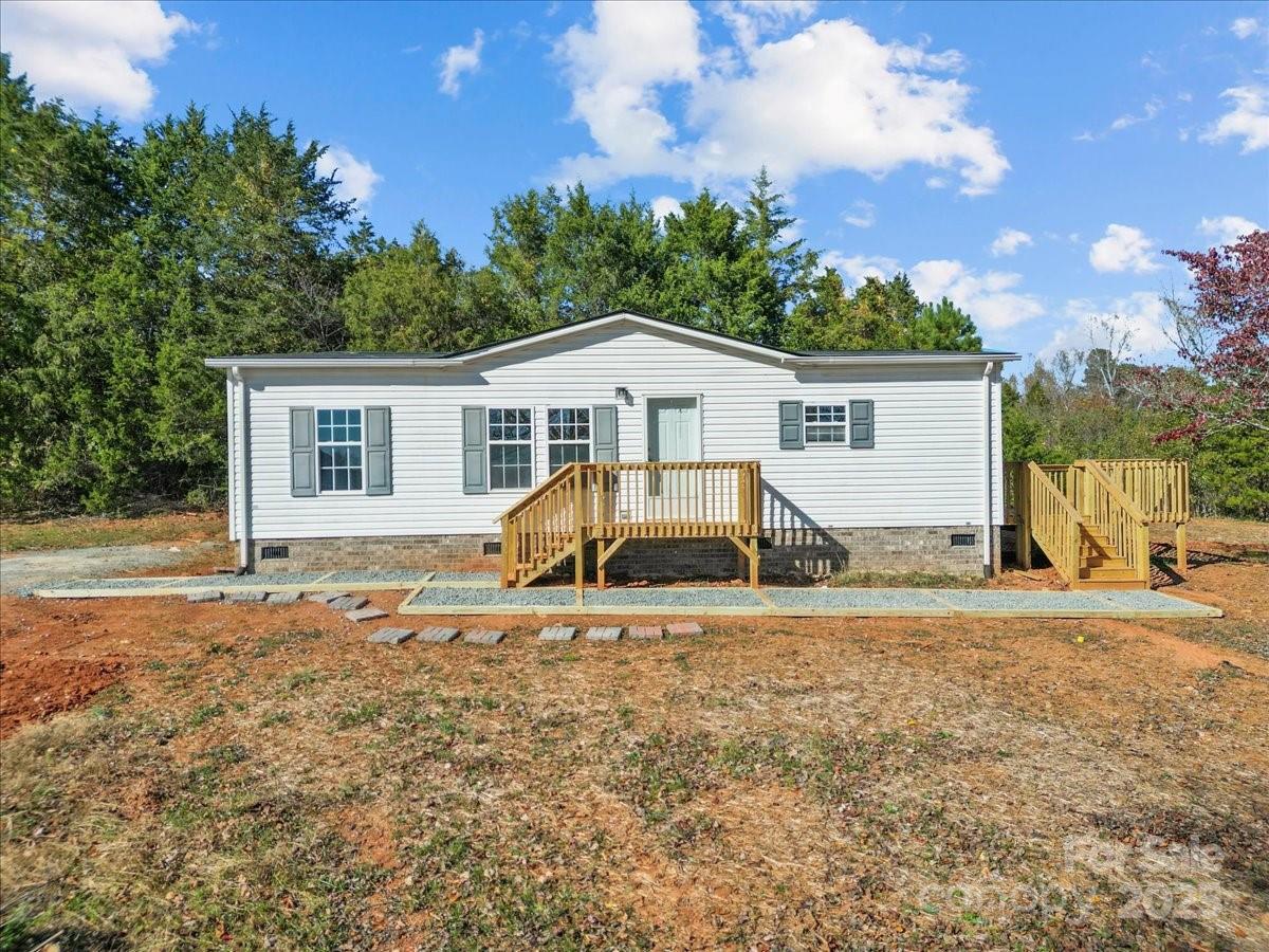 282 Bob Hardin Road Rutherfordton, NC 28139 - Photo 27 of 27 a view of a house with a yard and trees