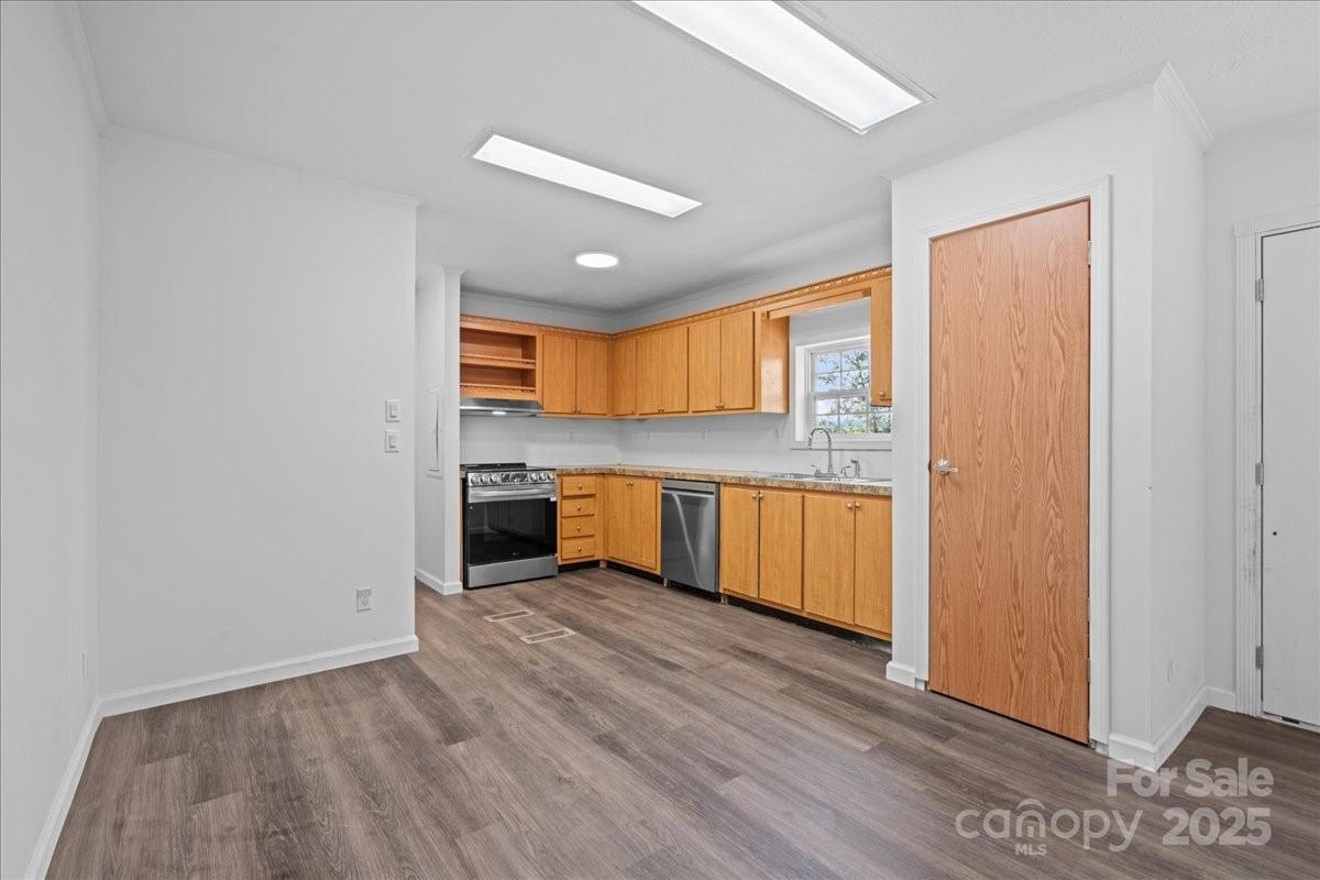 282 Bob Hardin Road Rutherfordton, NC 28139 - Photo 5 of 27 a view of kitchen with granite countertop cabinets and wooden floor