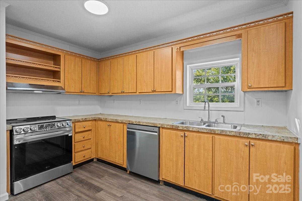 282 Bob Hardin Road Rutherfordton, NC 28139 - Photo 6 of 27 a kitchen with granite countertop cabinets stainless steel appliances and a sink