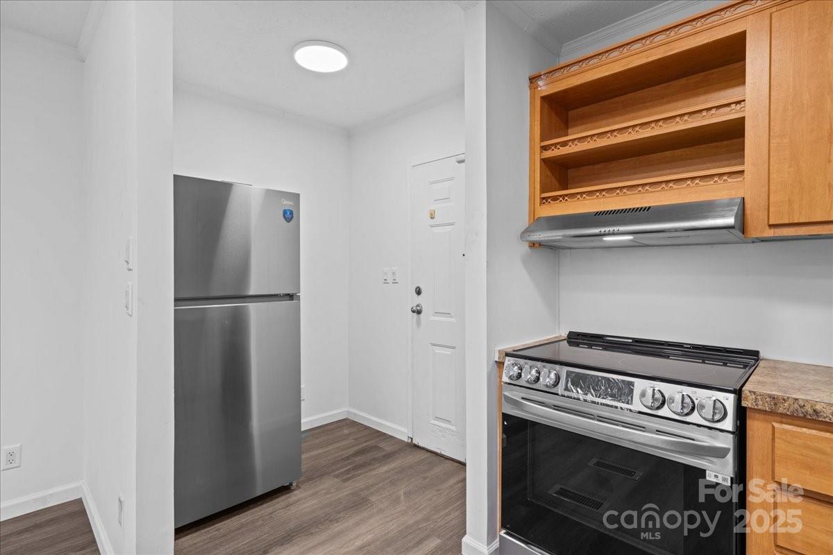282 Bob Hardin Road Rutherfordton, NC 28139 - Photo 7 of 27 a kitchen with a stove and a refrigerator