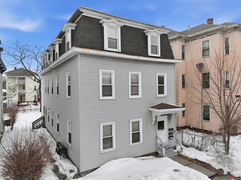 15 Goulding Street Worcester, MA 01609 - Photo 1 of 16 a front view of a house with a yard