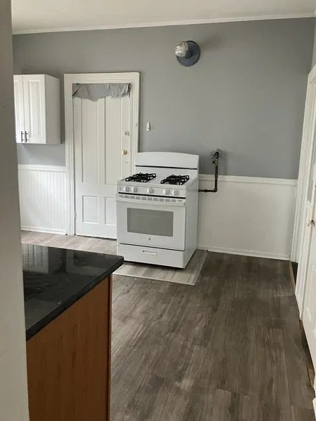 15 Goulding Street Worcester, MA 01609 - Photo 12 of 16 a kitchen with granite countertop a sink and a stove top oven