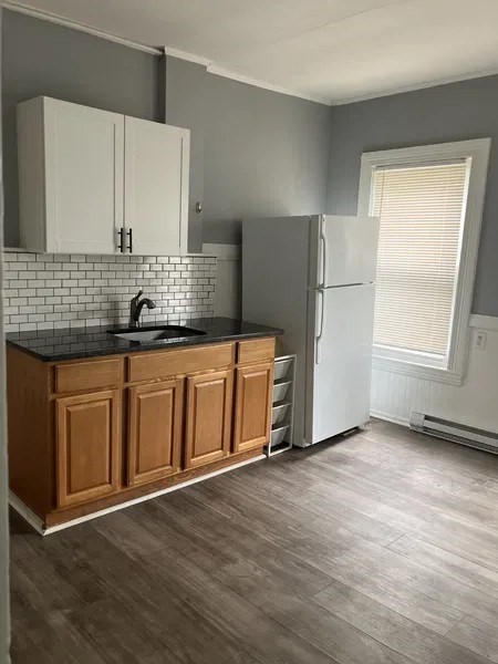 15 Goulding Street Worcester, MA 01609 - Photo 14 of 16 a kitchen with stainless steel appliances granite countertop a refrigerator and a sink