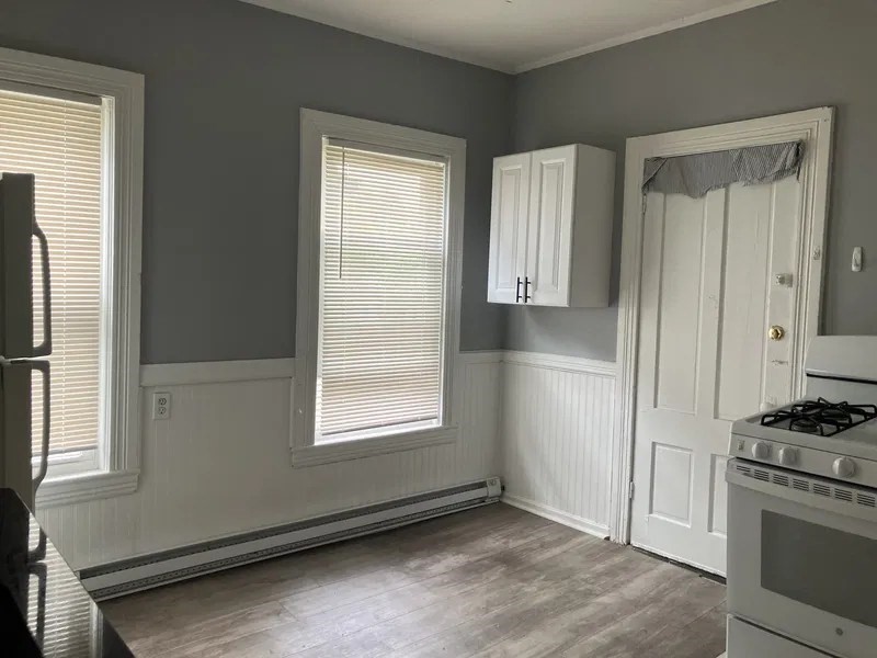 15 Goulding Street Worcester, MA 01609 - Photo 16 of 16 an empty room with windows and cabinet