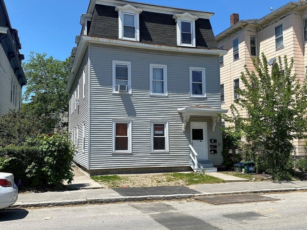 15 Goulding Street Worcester, MA 01609 - Photo 6 of 16 a front view of a house with a yard