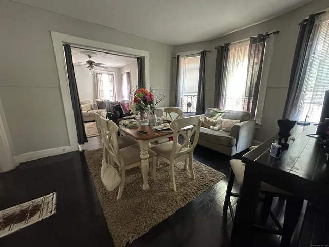 a view of a dining room with furniture and window